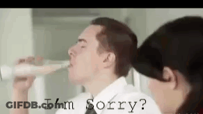 Man Drinking From Bottle While Woman Says I'm Sorry GIF