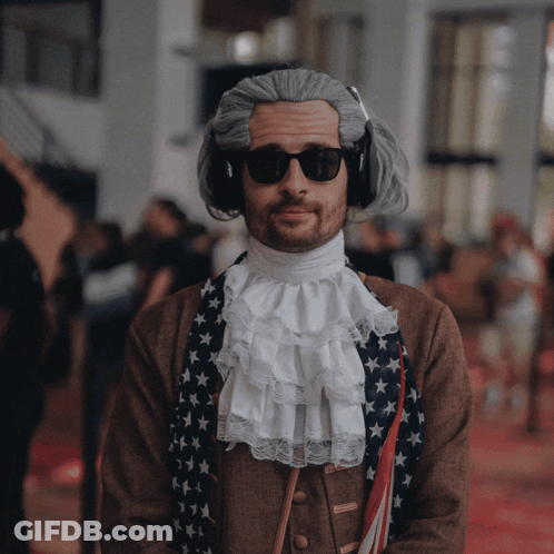 Man Drinking From Cup Next To Man Making Funny Face GIF
