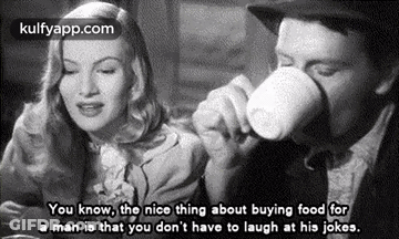 Man Drinking From Cup While Woman Looks On GIF