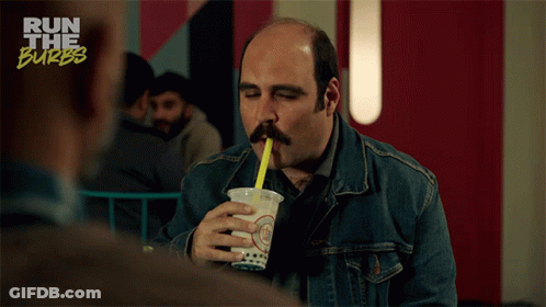 Man Drinking From Cup With Yellow Straw GIF