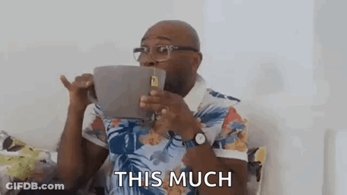 Man Drinking From Giant Coffee Mug On Couch GIF