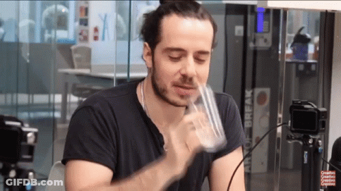 Man Drinking From Glass Before Art Of Break Sign GIF