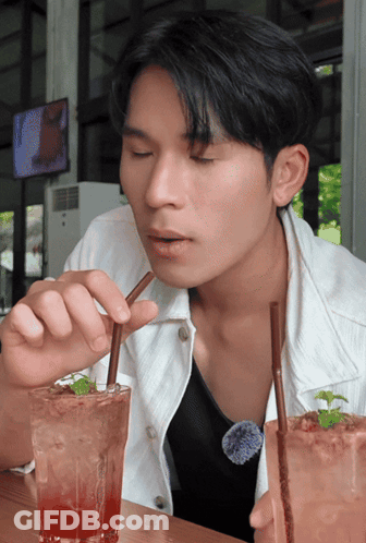 Man Drinking From Glass With Straw GIF