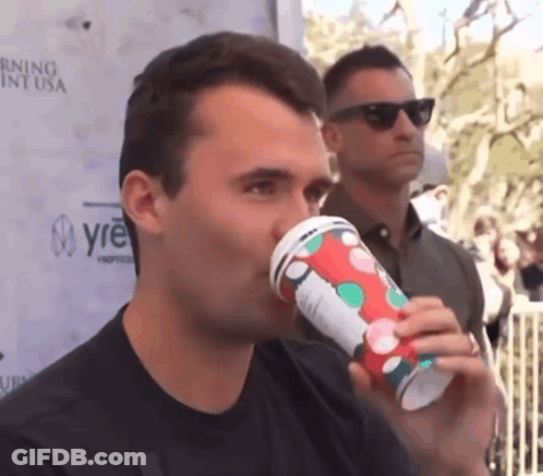 Man Drinking From Polka Dot Cup GIF