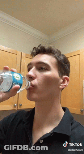 Man Drinking Water From Dolphins Bottle GIF