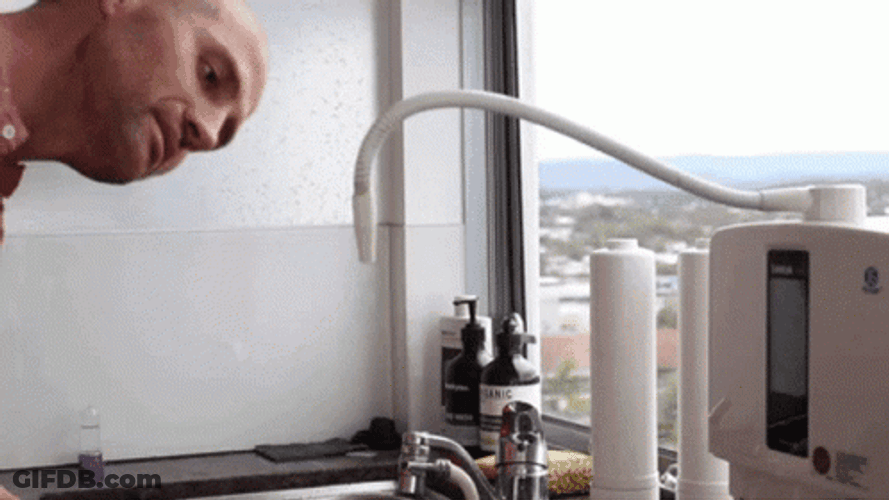Man Drinking Water Spout GIF