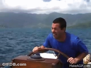 Man Driving Boat In Ocean GIF