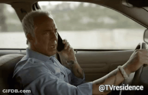 Man Driving Car And Talking On Cell Phone GIF