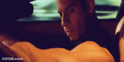 Man Driving Car Arms Outstretched Looking Out Window GIF