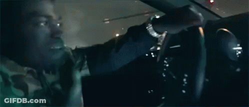 Man Driving Car At Night With Another Looking On GIF