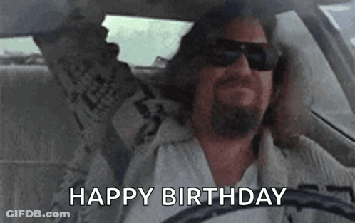 Man Driving Car Holding Newspaper GIF