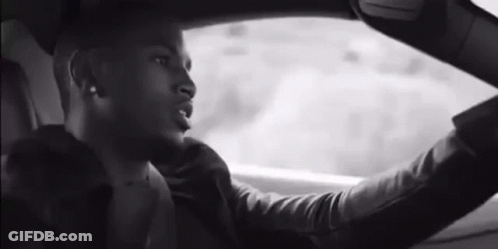 Man Driving Car Looking Out Window GIF