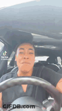 Man Driving Car Making Face GIF