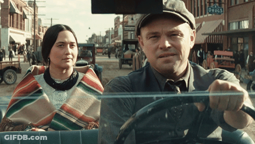 Man Driving Car Next To Woman GIF