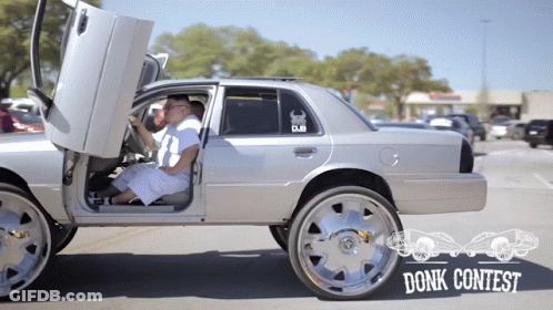 Man Driving Car With Don't Contest Sticker GIF