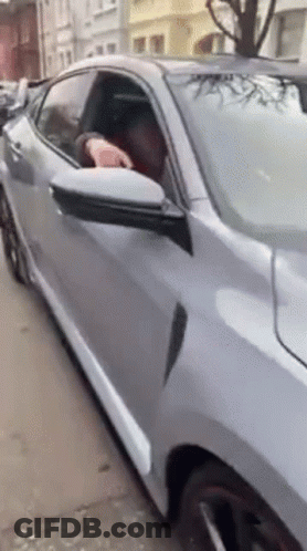 Man Driving Car With Head Out Window GIF
