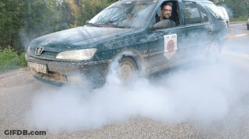 Man Driving Car With License Plate TCW 924 GIF