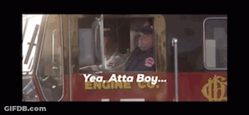Man Driving Fire Truck Saying Yea Atta Boy GIF