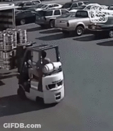 Man Driving Forklift In Parking Lot GIF