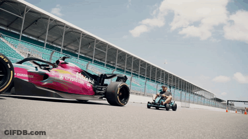 Man Driving Go Kart Next To Crypto.com Race Car GIF