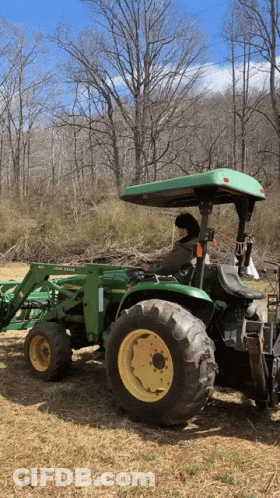 Man Driving Green John Deere Tractor In Field GIF