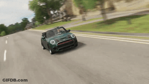 Man Driving Green Mini Cooper On Road GIF