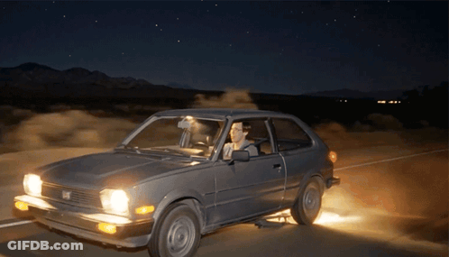 Man Driving Honda On Desert Road At Night GIF