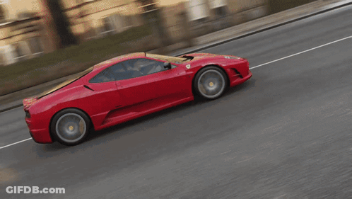 Man Driving Red Toy Car With Duck Face GIF
