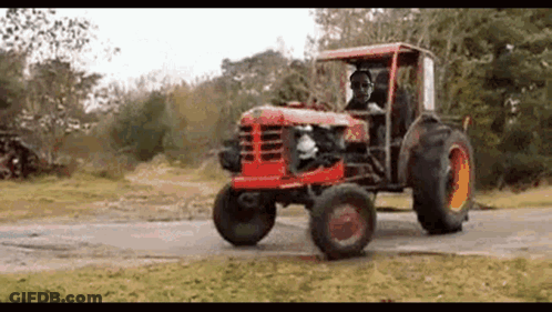 Man Driving Red Tractor GIF