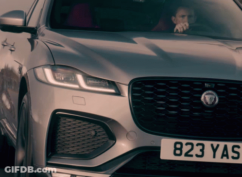 Man Driving Silver Jaguar With 823 Yas GIF