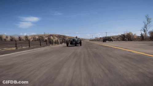 Man Driving Three-Wheeled Vehicle On Desert Road GIF