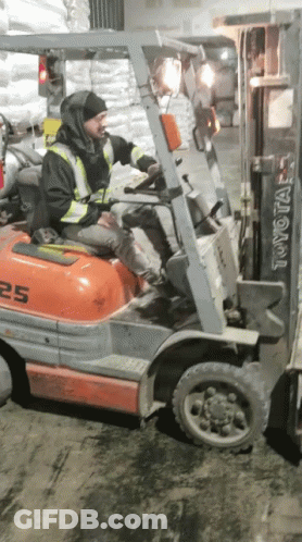 Man Driving Toyota 25 Forklift In Warehouse GIF