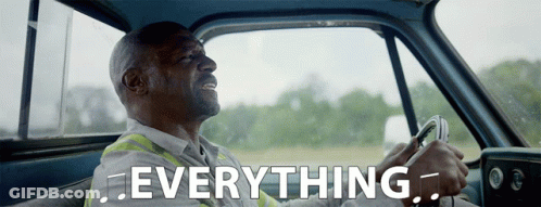 Man Driving Truck With Everything Text GIF