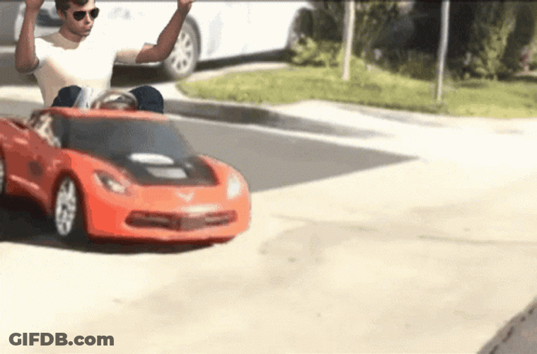 Man Driving With Toy Race Car GIF