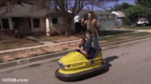 Man Driving Yellow Bumper Car Number 01 GIF