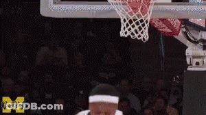 Man Dunking Basketball In Front Of Crowd GIF