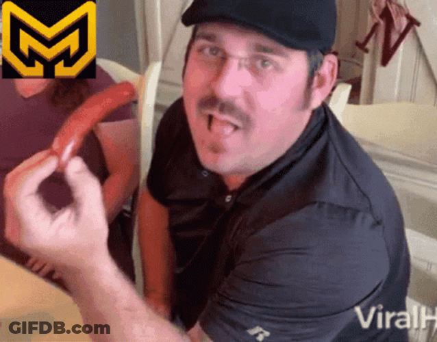 Man Eating A Whole Sausage GIF