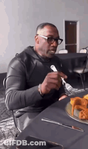 Man Eating Chicken Wings With Fork And Knife GIF
