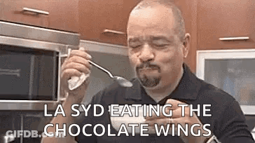 Man Eating Chocolate Wings With Spoon GIF