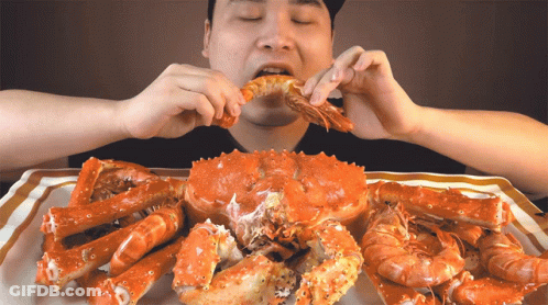 Man Eating Crab And Shrimp GIF