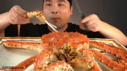 Man Eating Crab With Fork And Knife GIF