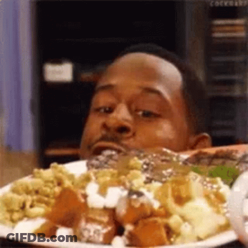Man Eating Food And Looking At Camera GIF