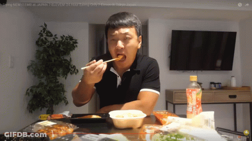 Man Eating Food At Table With Orange Juice GIF