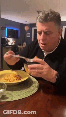 Man Eating Food With Spoon GIF