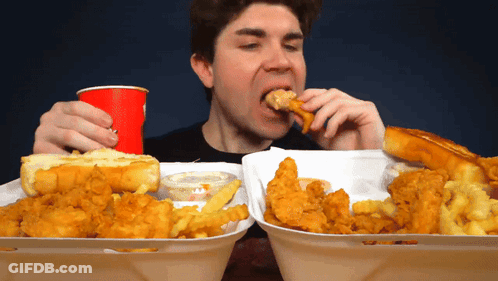 Man Eating Fried Chicken And French Fries GIF