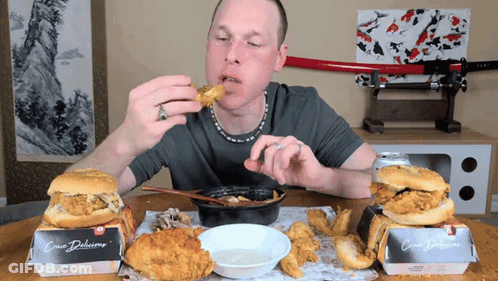 Man Eating Fried Chicken Box Saying Crispy Delicious GIF