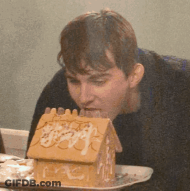 Man Eating Gingerbread House GIF