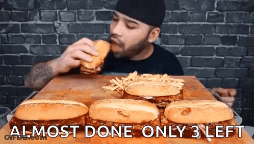 Man Eating Hamburger And French Fries GIF