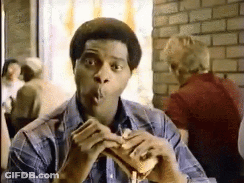Man Eating Hamburger And Smoking Cigarette GIF
