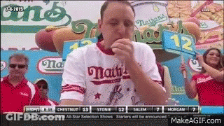 Man Eating Hot Dog With Dog Sign GIF